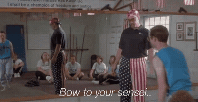 A Group Of People In A Gym With The Words Bow To Your Sensei Written On The Bottom GIF