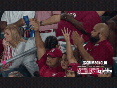 A Group Of People In A Stadium Watching A Football Game Between Oklahoma And Ucla GIF