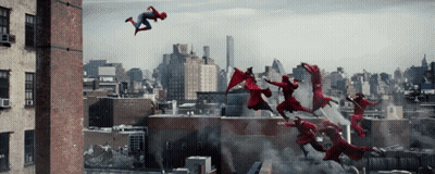 A Group Of People In Red Superhero Costumes Are Flying Through The Air GIF