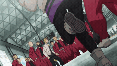 A Group Of People In Red Uniforms Are Standing In Front Of A Sign That Says " Tokyo " GIF