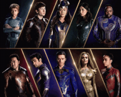 A Group Of People In Superhero Costumes Standing Next To Each Other . GIF