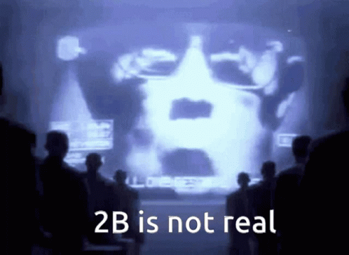 A Group Of People Looking At A Screen That Says " 2B Is Not Real " GIF