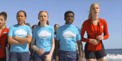 A Group Of People On A Beach With A Netflix Logo In The Corner GIF