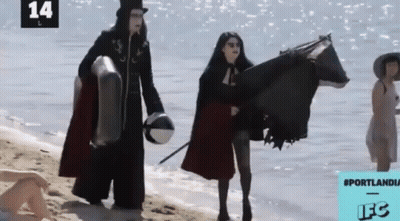 A Group Of People On A Beach With The Number 14 On The Bottom Right GIF