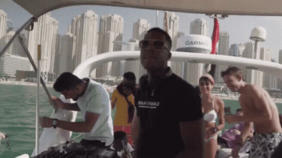 A Group Of People On A Boat With A Garmin On The Top GIF