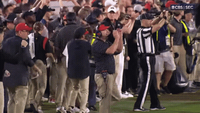 A Group Of People On A Field With A Cbs Sec Logo In The Corner GIF