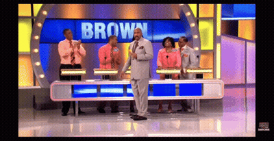 A Group Of People On A Game Show With The Name Brown On The Screen GIF