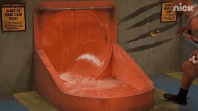 A Group Of People On A Water Slide With The Nick Logo In The Corner GIF