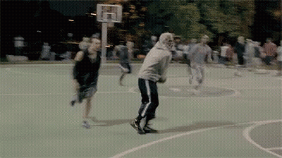 A Group Of People Playing Basketball On A Court GIF
