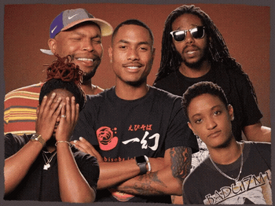A Group Of People Posing For A Picture With One Wearing A Shirt That Says Bisoba On It GIF