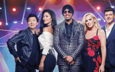 A Group Of People Posing For A Picture With One Wearing Sunglasses GIF