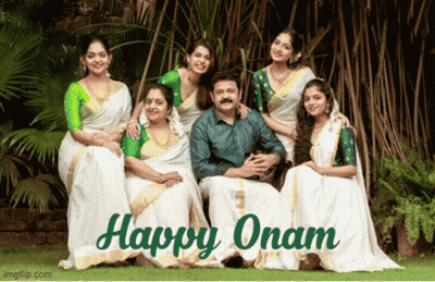 A Group Of People Posing For A Picture With The Words Happy Onam Below Them GIF