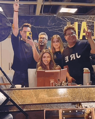 A Group Of People Posing In Front Of A Mirror With One Wearing A Shirt That Says Earl GIF