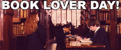 A Group Of People Reading Books In A Library With The Words Book Lover Day Below Them GIF