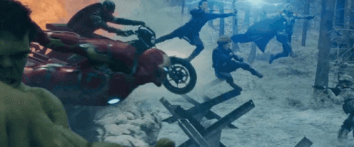 A Group Of People Riding Motorcycles In A Snowy Forest GIF