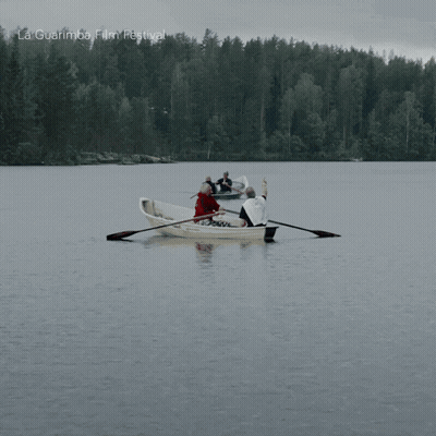 A Group Of People Rowing A Boat In A Lake With La Guarimba Film Festival Written On The Bottom Of The Image GIF