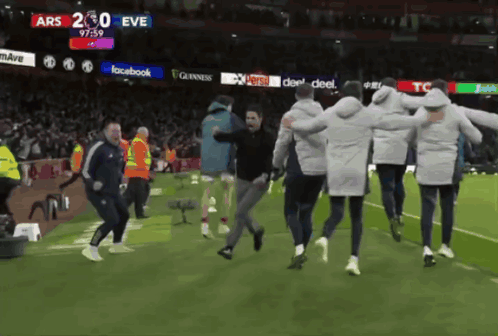 A Group Of People Running On A Soccer Field With A Score Of Ars 230 Eve GIF