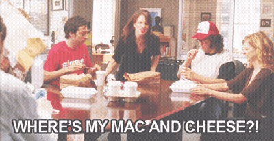 A Group Of People Sitting Around A Table With The Words Where 'S My Mac And Cheese ? GIF