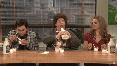A Group Of People Sitting At A Table With Bottles Of Mayonnaise On It GIF