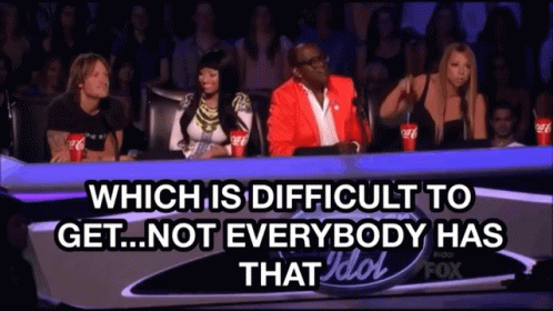 Group Sitting At Table With Difficulties And Idol Text GIF