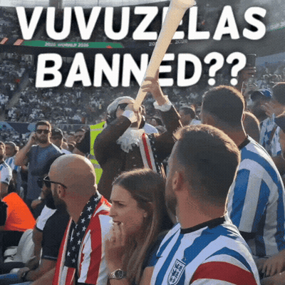 A Group Of People Sitting In A Stadium With A Sign That Says ' Uvuzlas Banned ' GIF