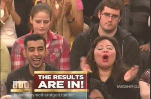 A Group Of People Sitting In Front Of A Screen That Says The Results Are In GIF