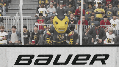 A Group Of People Sitting In Front Of A Sign That Says Bauer On It GIF