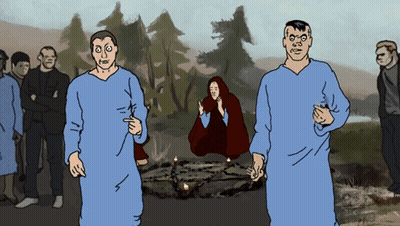 A Group Of People Standing Around A Circle With Candles In It GIF