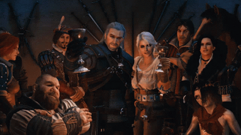 A Group Of People Standing Around A Man Holding A Glass GIF
