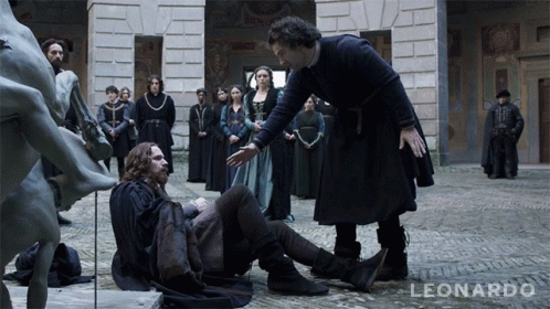 A Group Of People Standing Around A Statue With The Word Leonardo On The Bottom Right GIF