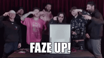 A Group Of People Standing Around A Table With A Sign That Says Faze Up In Front Of Them GIF