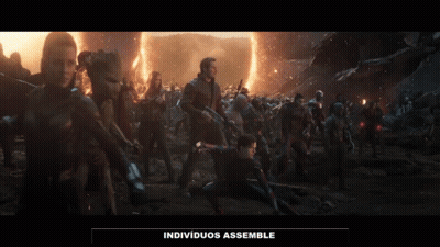 A Group Of People Standing In A Field With The Words Individuos Assemble Written On The Bottom GIF