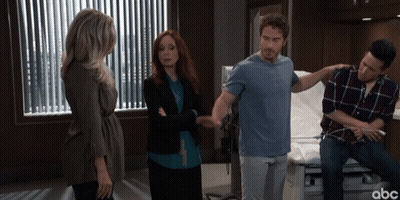 A Group Of People Standing In A Hospital Room With Abc Written On The Bottom Right GIF