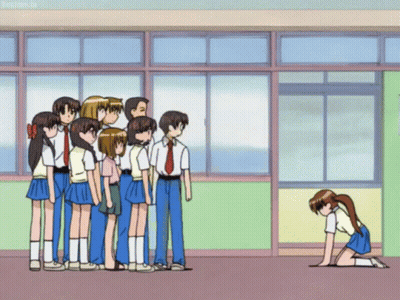A Group Of People Standing In A Line With One Girl Kneeling Down In Front Of Them GIF