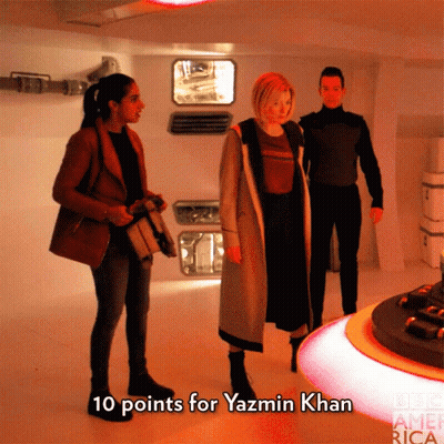 A Group Of People Standing In A Room With The Words " 10 Points For Yazmin Khan " On The Bottom GIF