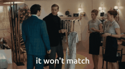A Group Of People Standing In A Room With The Words " It Won 'T Match " GIF