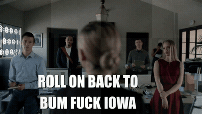 A Group Of People Standing In An Office With The Words Roll On Back To Bum Fuck Iowa On The Bottom GIF
