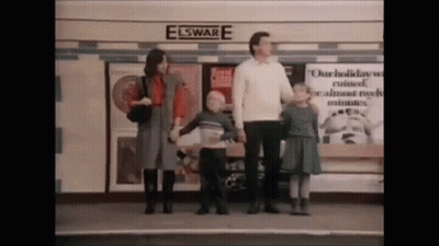 A Group Of People Standing In Front Of A Building That Says Elsware GIF