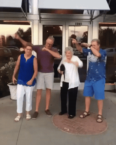 A Group Of People Standing In Front Of A Building With The Number 1261 On The Door GIF