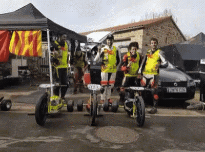 A Group Of People Standing In Front Of A Car With A License Plate That Says Yv7lc Gpd GIF