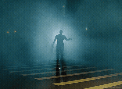 A Group Of People Standing In Front Of A Door That Says Exit On It GIF