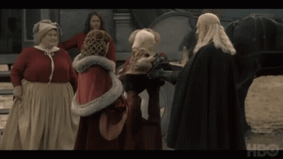 A Group Of People Standing In Front Of A Horse With Hbo Written On The Bottom GIF