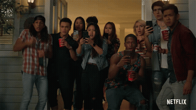 A Group Of People Standing In Front Of A House With Netflix Written On The Bottom Right GIF