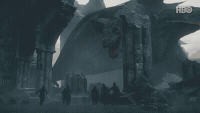 A Group Of People Standing In Front Of A Large Dragon With Hbo Written On The Bottom GIF