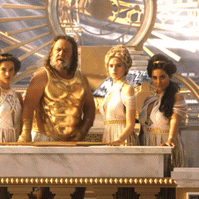 A Group Of People Standing In Front Of A Marble Table GIF
