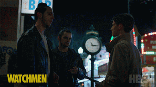 A Group Of People Standing In Front Of A Sign That Says Crack On It GIF