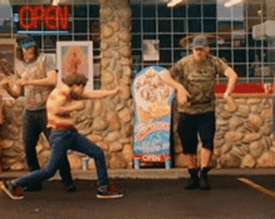 A Group Of People Standing In Front Of A Store With An Open Sign GIF
