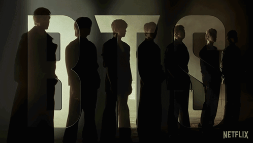A Group Of People Standing In Front Of The Word Bts On Netflix GIF