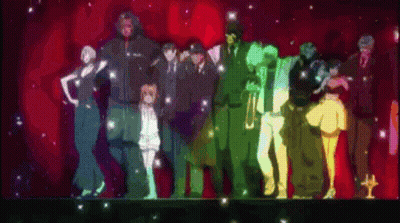 A Group Of People Standing Next To Each Other On A Stage With A Red Background GIF
