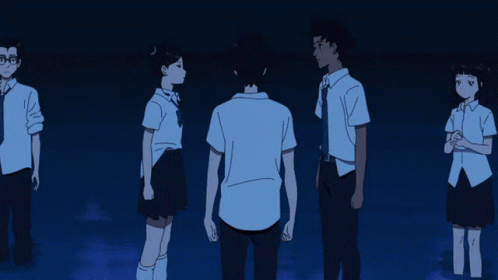 A Group Of People Standing Next To Each Other With A Man Standing In The Middle GIF